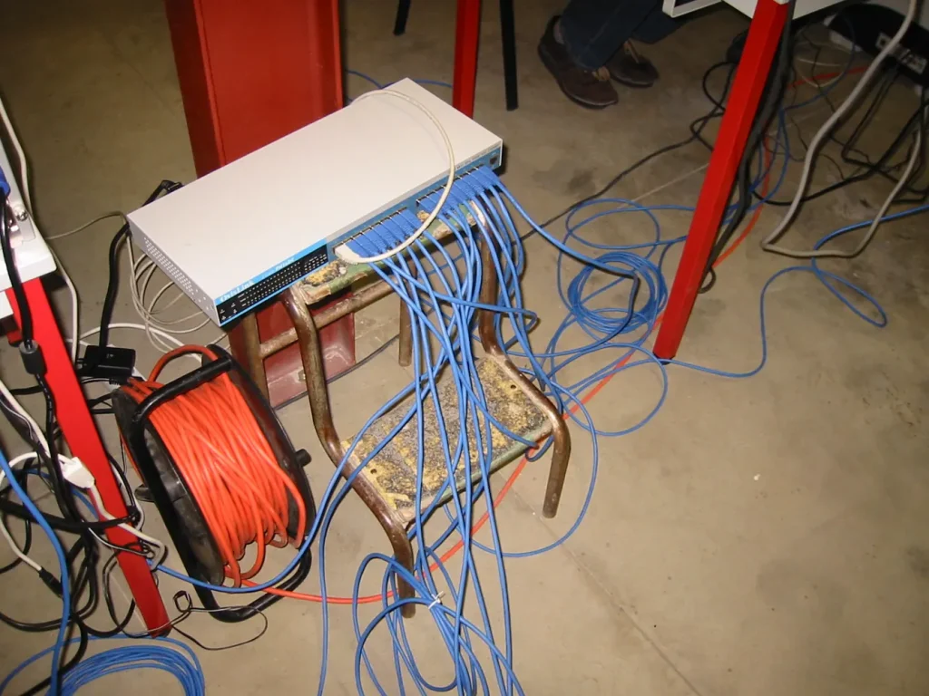 Network cables running to a switch at a LAN party