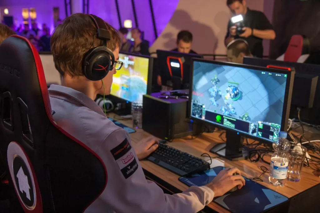 Esports player wearing a gaming headset at a tournament