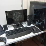 A finished gaming PC setup with monitor, keyboard and tower
