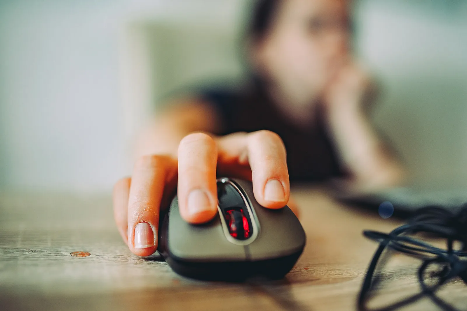 Hand on a computer mouse
